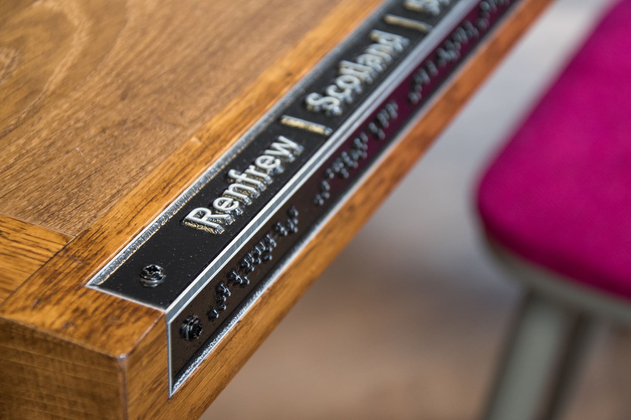 Customer experience design detail with accessible retail and braille signage